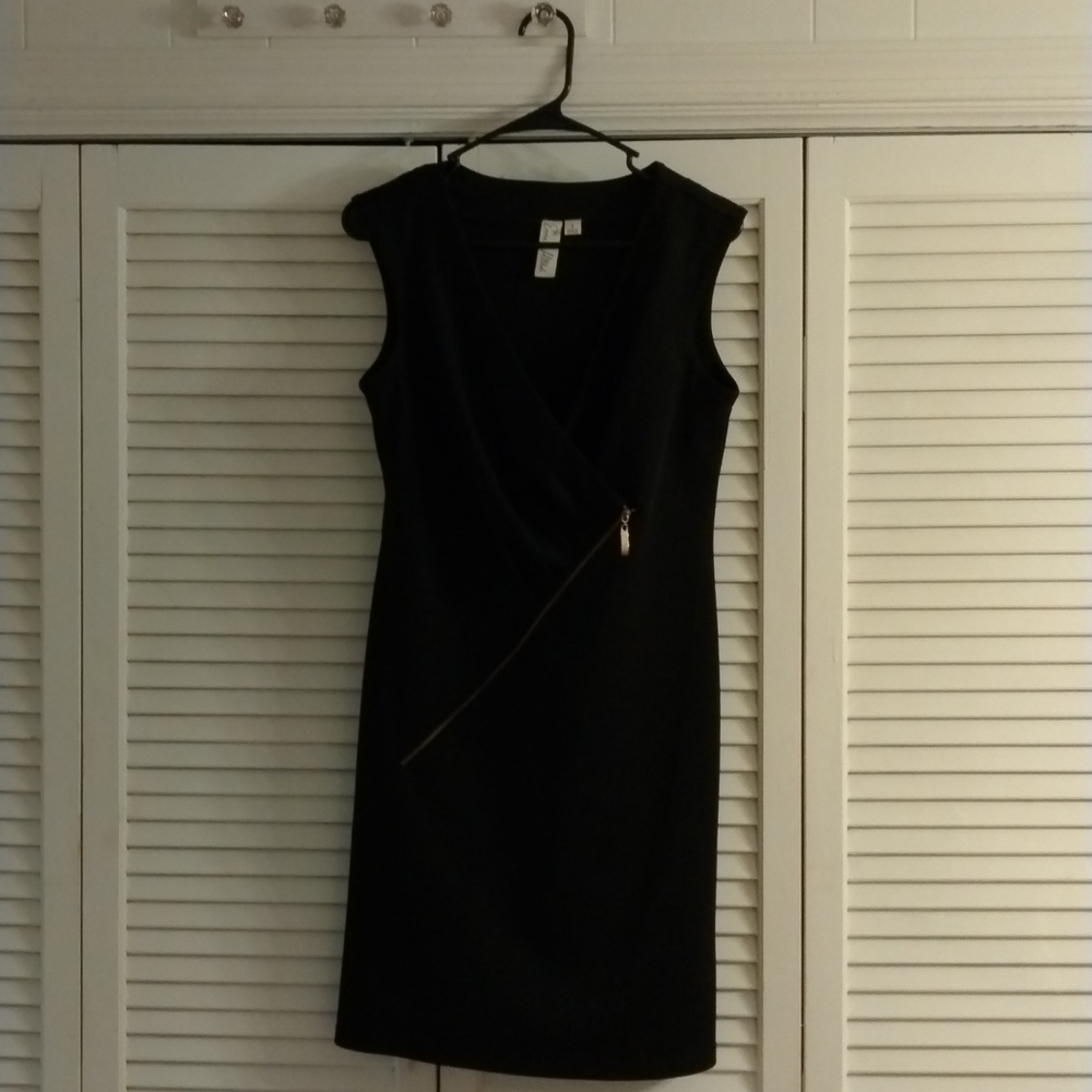 Women's black dress with gold zipper details